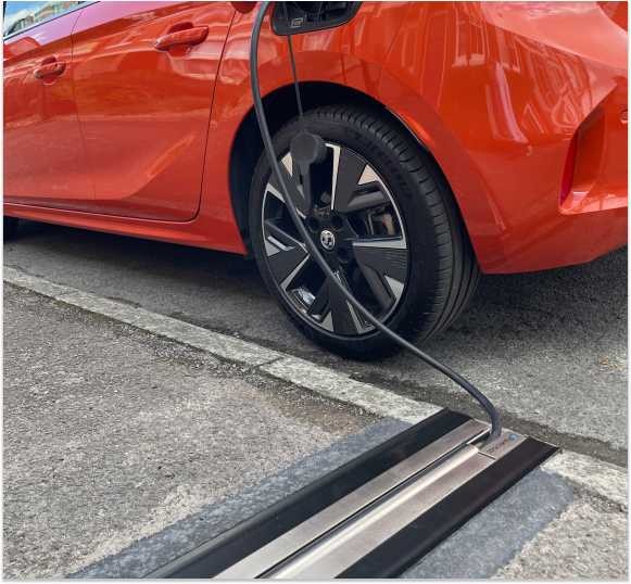 Charging at Home Without a Driveway: The Rise of Across-Pavement Solutions